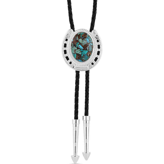 Crafted for the courageous, fearless, and daring trailblazers. A bright silver-finished bolo is shaped into a horseshoe with black paint to contrast the bright silver functions as the backdrop for the large center stone. Serving as the centerpiece is a compressed stone with hues of blue-greens and browns creating a strong and bold look. The black braided leather cord is weighted with two silver arrow pointed tips to complete the Pioneer Turquoise Bolo Tie. Stone color will vary.