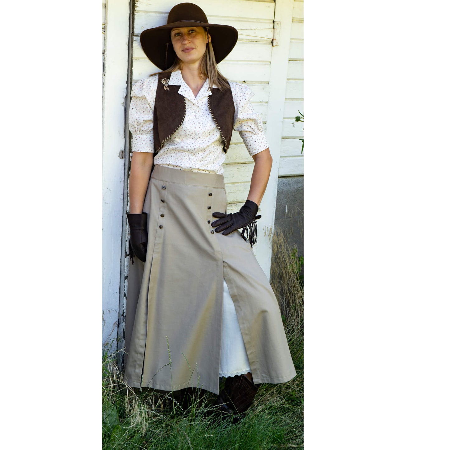 Feel the influence of Prairie Rose in this old western style skirt. Full cut skirt with front gore that opens half way down to reveal the soft ivory cotton lining with a lace trimmed hem. Waistband has elastic in the back for easy wear and comfort fit with eight non-functional antique brass rose buttons. 100% Cotton. Made in USA