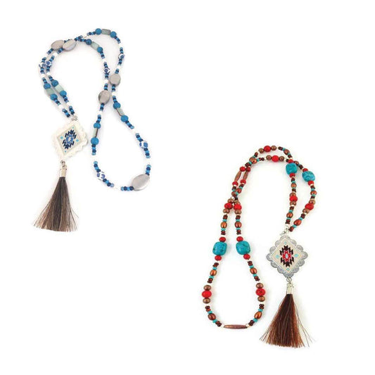 A lasso of blue howlite, freshwater pearls, seed beads and silver metal beads, boasts the Prescott Aztec medallion and an Authentic Horse Hair tassel. Go great with jeans or dress up your that outfit to your next event and add some color! 33 inches long.