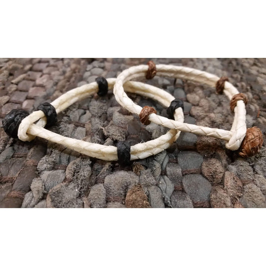 Rawhide western bracelet with easy cowboy style on-off sliding Rawhide knot. This one will capture your wild west heart. Perfect for Cowgirls or a Cowboy. Total length from end to end is 9 inches. Choose between white rawhide with black or brown leather tr