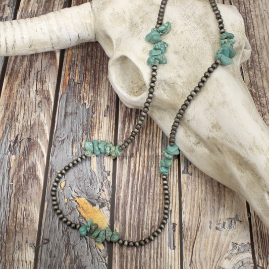 This necklace features 24" of Navajo beads with turquoise beads clusters, perfect for adding a unique, meaningful touch to any outfit. With its sleek chrome beads and eye-catching clusters, this western style necklace is sure to become a favorite in any jewelry collection.