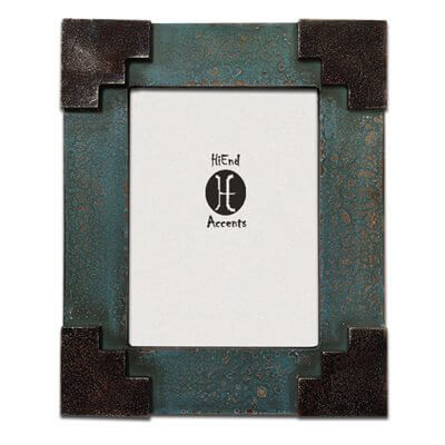 Enhance your rustic decor with this Southwest style frame with a Santa Fe inspired corner detail in a turquoise photo frame. For photographs measuring 6" X 8". Can be utilized with either vertical or horizontal photographs. Back has swing tabs for easy installation, and a thick layer of glass protects your image. Measures 12" X 10" X 0.8". Imported.