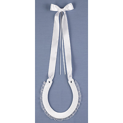 White satin horseshoe with braided trim and chiffon ruffle. Satin ribbon handle with streamers for tying rings. 5-1/2" x 6".