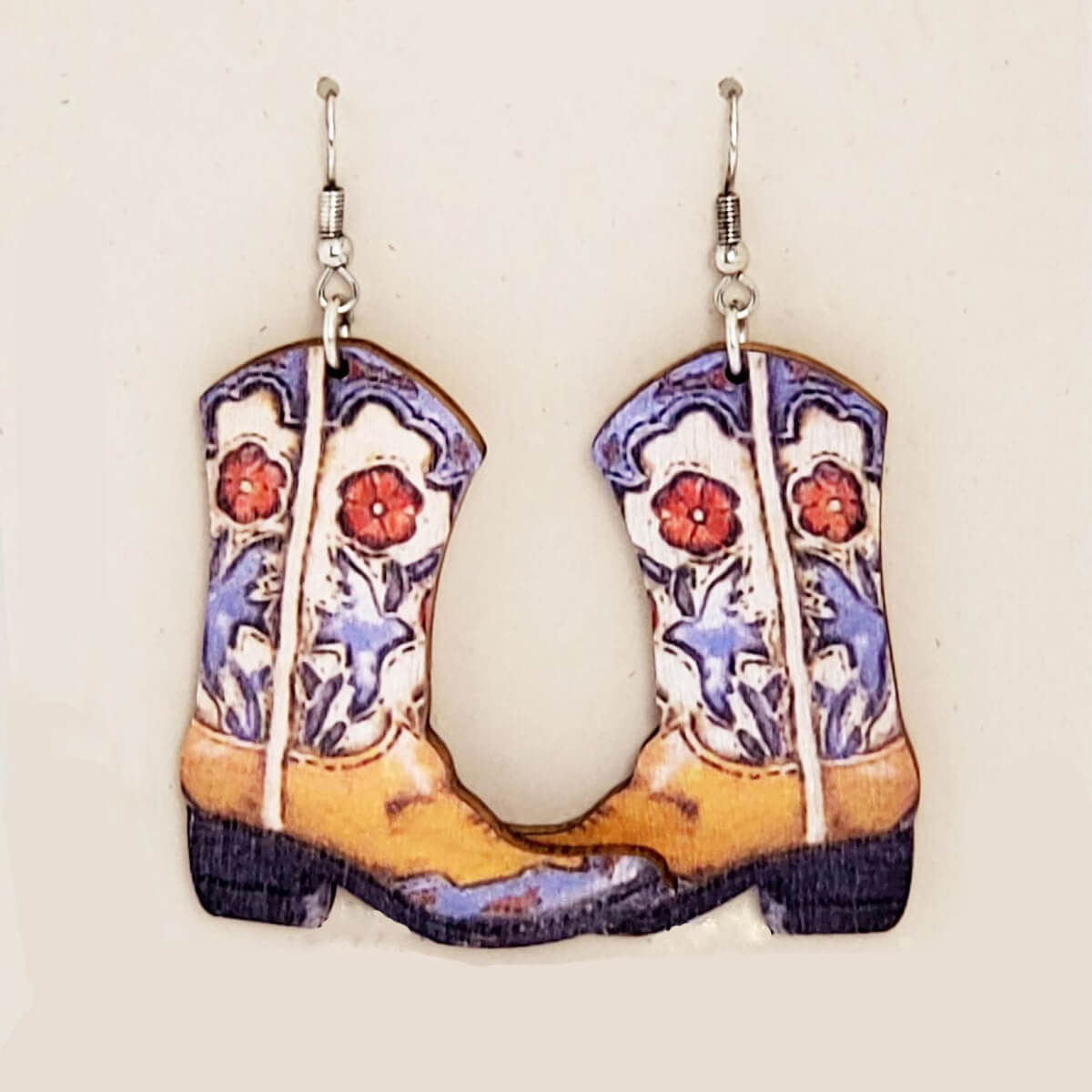 The light weight wooden pair of boots measure 2 inches long from the hypo-allergenic ear wire to the bottom of these earrings and the widest part measures 1 1/2 inches. Sassafras is how I would describe this pair!