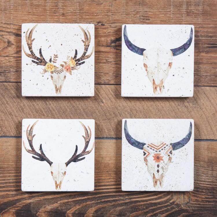 This Skull Coaster Set features natural travertine stone construction. Absorbent stoneware helps to protect furniture from drips and condensation. Durable cork backing helps to keep your coaster in place along with protecting your furniture from scratches. 4 sets of 4 coasters per pack. Each coaster measures 4"x4". Made from natural travertine stone. Wipe clean. Imported.