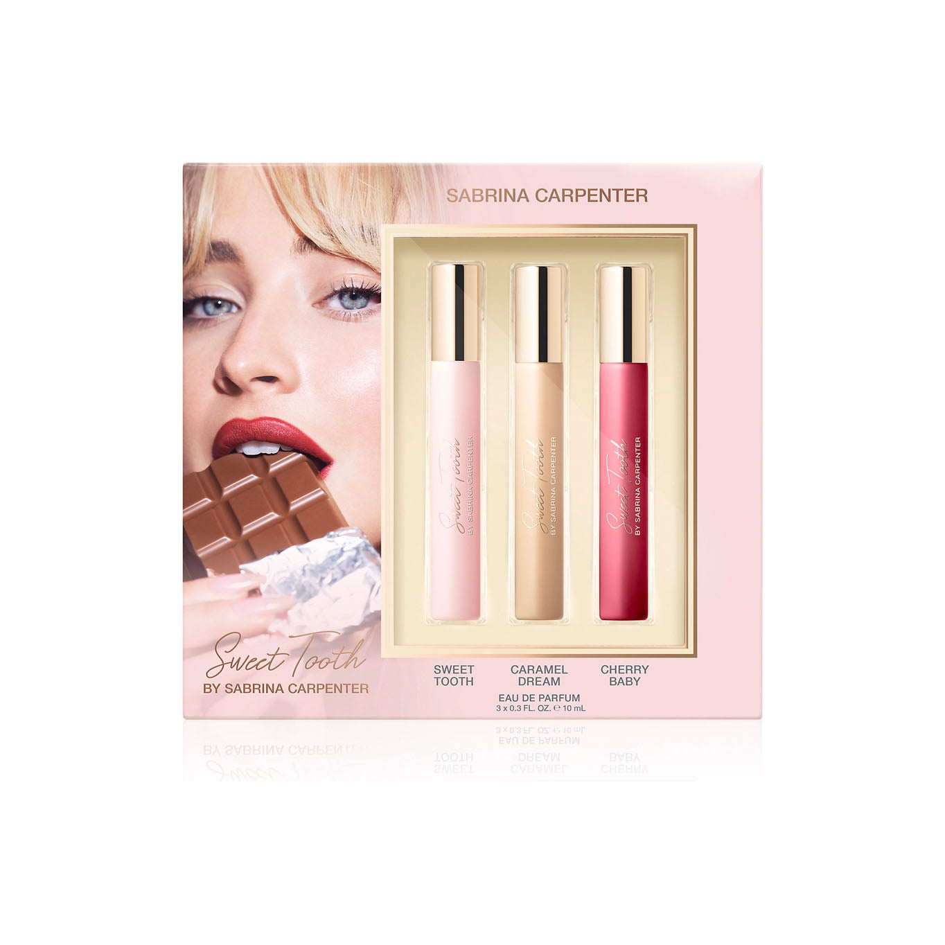 Sabrina Carpenter perfume set with three bottles in a box, featuring a model holding a chocolate bar.