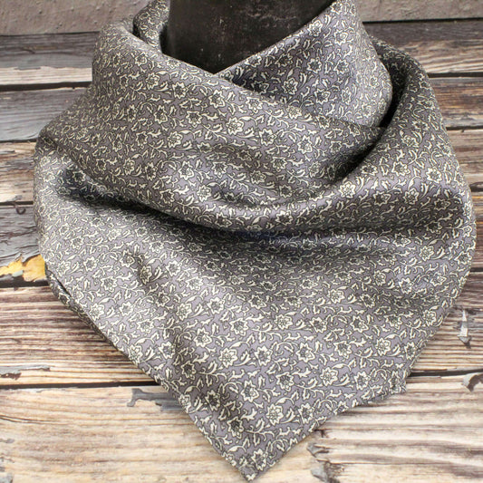 Floral patterned scarf on a wooden surface