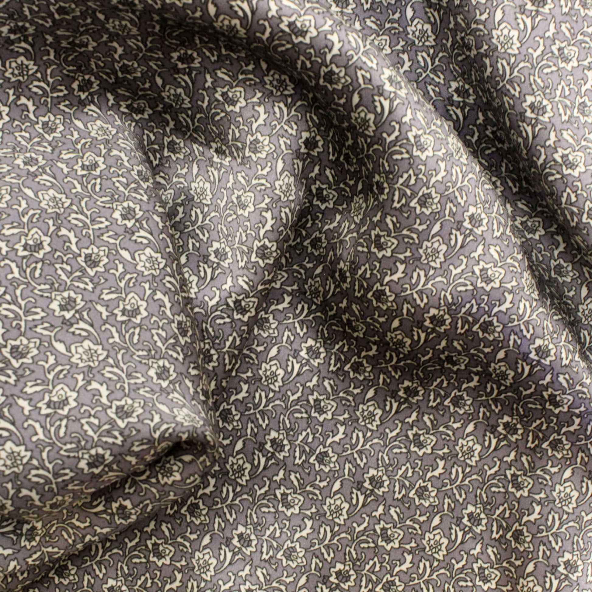 Floral patterned fabric with a dark background