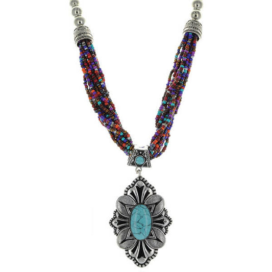 Turn heads in the Santa Fe Necklace! Multiple strands of colorful beads in cheerful hues of blue, pink, purple and silver add playful texture. The focal point is a beautiful pendant that makes a bold statement. Matching drop earrings pull the look together. This 22-24” necklace layers beautifully over everything from tanks to tunics with its versatile length. Add an instant dose of style and personality to any outfit with this boho chic stunner.