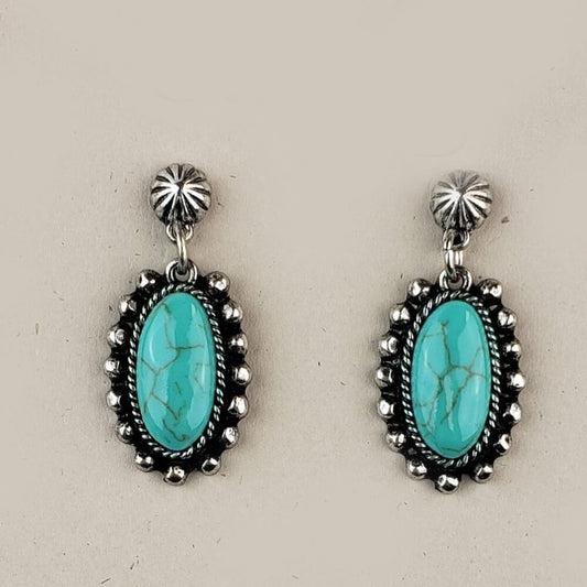 Wear these gorgeous earrings with any outfit choice. The hypoallergenic post holds a Faux Turquoise stone engulfed in a Victorian oval frame Measures 1.25″ from top to bottom of the pendant.