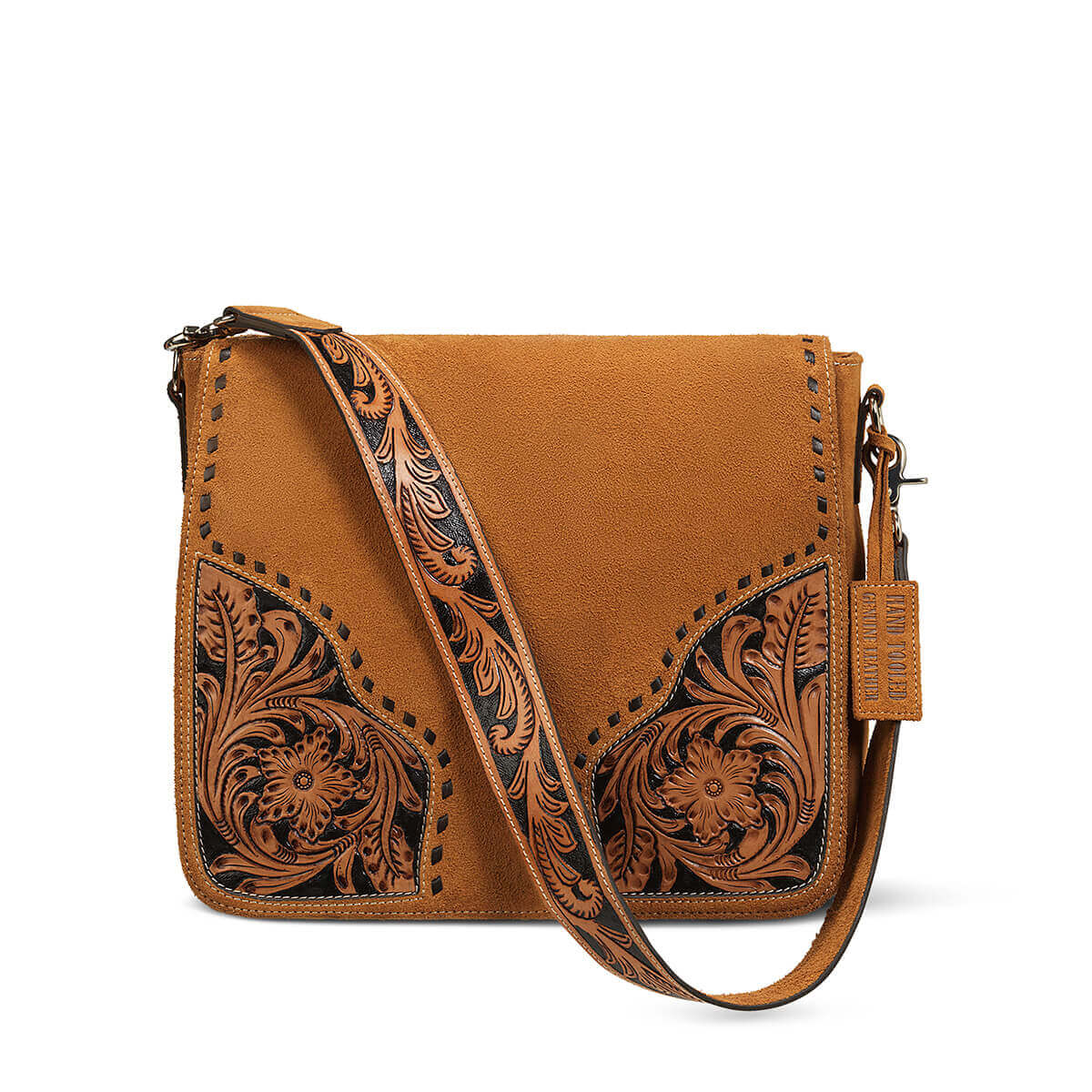 A tan leather crossbody bag with hand-tooled floral detailing on the front panels and a matching tooled shoulder strap, shown on a clean white background.