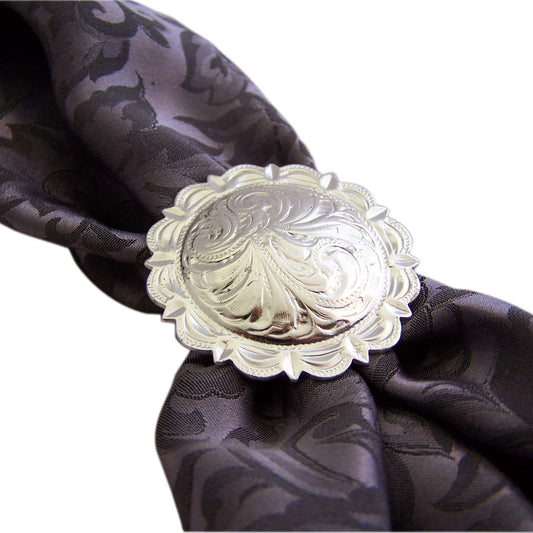 It has a scalloped edge and traditional etched floral design make this slide a true western beauty. This silver scarf slide has a double ring back and will surely add a nice touch to any colorful scarf. Measures 1-1/2".