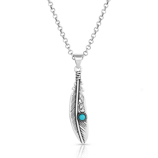 Take flight with a stunning silver and turquoise feather necklace. This intricately detailed feather also contains a pop of turquoise. Antiquing provides contrast and brings out the details in the design of the Solo Flight Turquoise Feather Necklace. The necklace is secured by an 18 inch silver tone chain. Pair this gorgeous necklace with a flannel shirt and jeans or a pretty dress for a feminine look and feel. Silver over brass. Synthetic turquoise. Feather Pendant Measures Approx. 2" x .38"