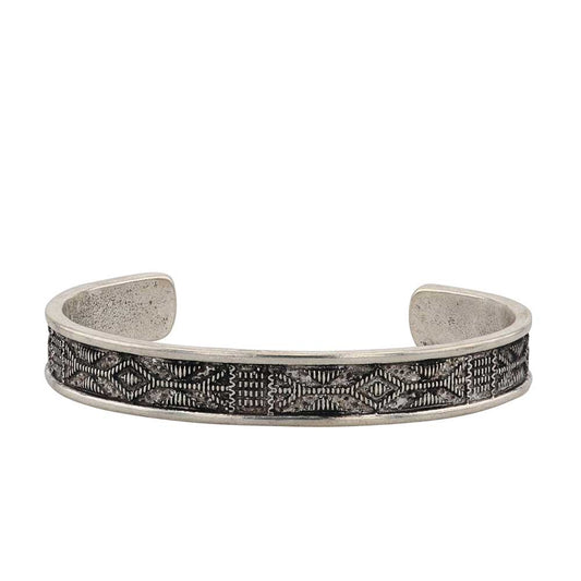 Fall in love with the dreamy Southwest Dreams Attitude Cuff Bracelet. This southwestern cuff bracelet features awe-inspiring etched geometric patterns as the main design. Smooth traces of silver enclose the center designs. The contrast between the smooth silver border and bold geometric designs creates a look that pulls you in. One size fits most. About 3/8" wide.