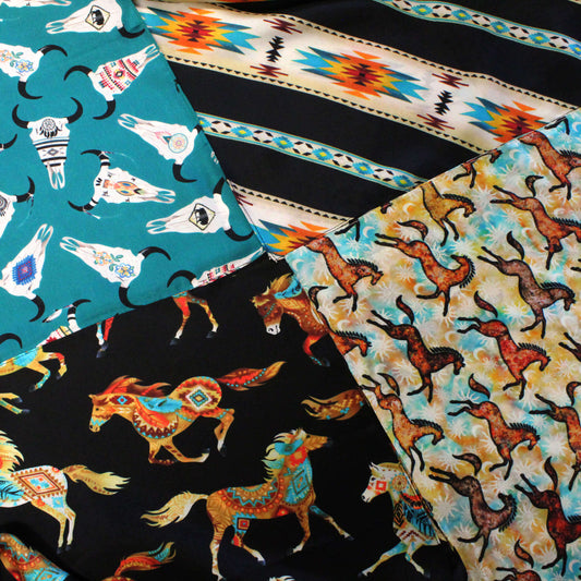 Collection of fabric swatches with animal patterns including horses and  cow skulls
