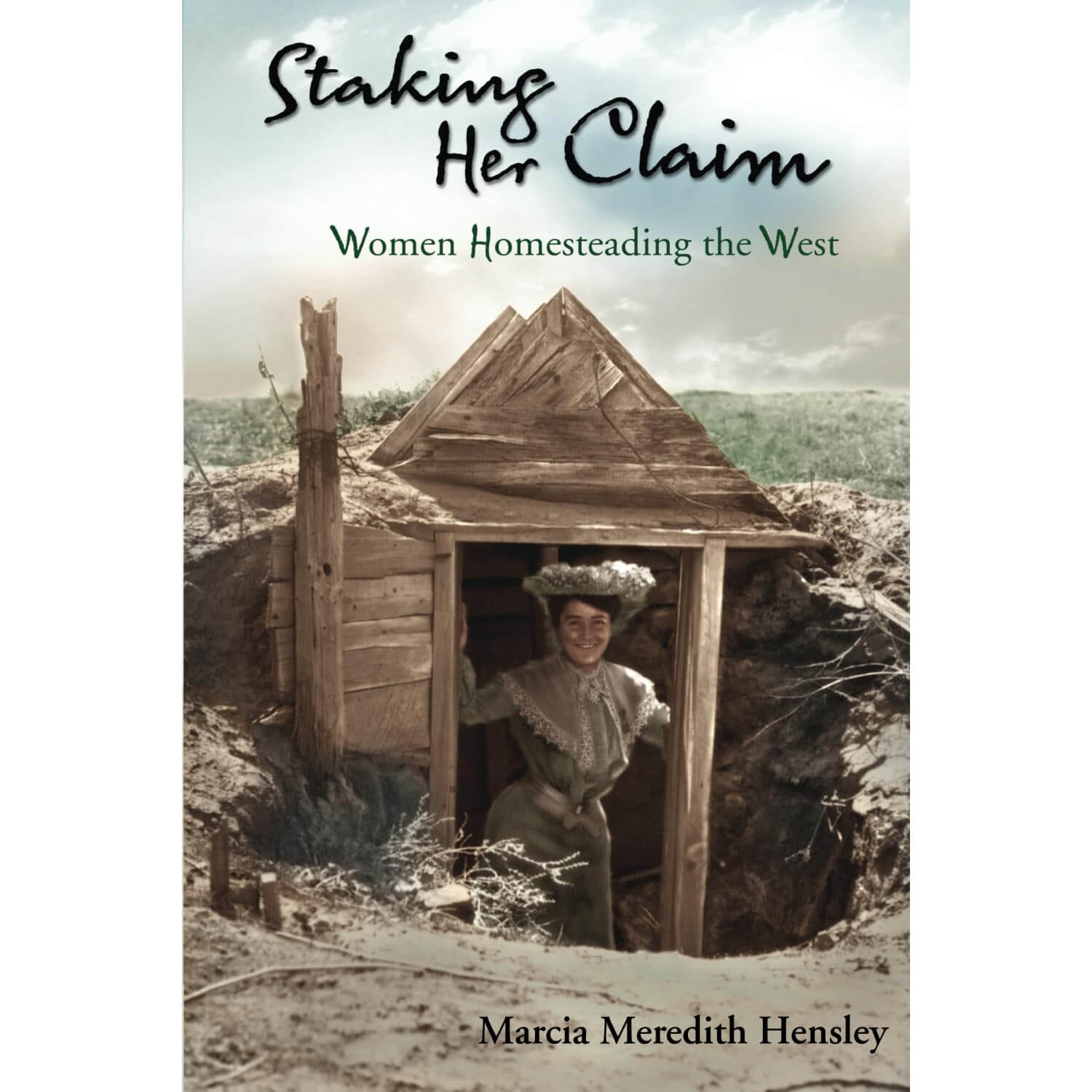 Book cover of 'Staking Her Claim: Women Homesteading the West' by Marcia Meredith Hensley, featuring a woman in front of a wooden cabin.