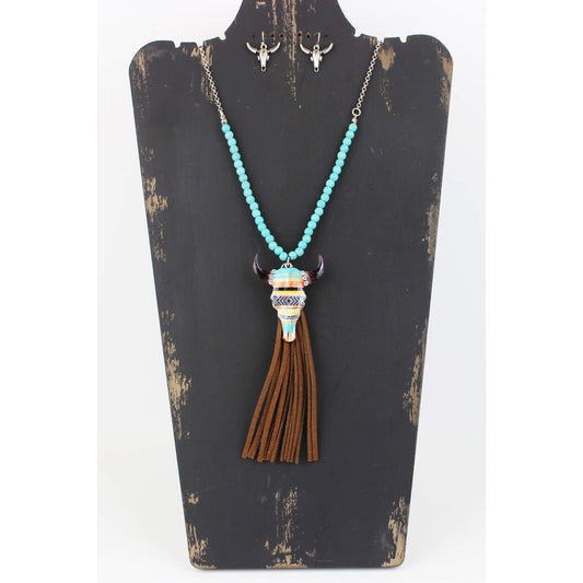 This long 32″ chain and mag turquoise bead necklace sports a 2.25″ steer head pendant with bright Native American inspired design. Coordinated steer head earrings measure .75″ from the base of the hypoallergenic ear wires to the bottom of the earring