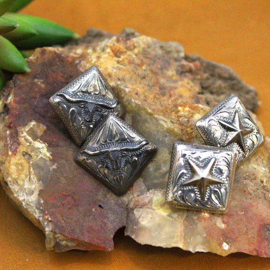 Sure to be a quality piece of jewelry that lasts and is handed down to generations. A classic design of western longhorn or western star hand engraved in sterling silver. Diamond shape earrings measure 1" x 1". Made in the USA by husband and wife team.