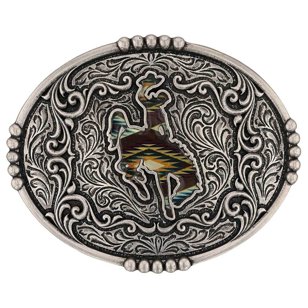 Decorative belt buckle with intricate patterns and a central design on a white background