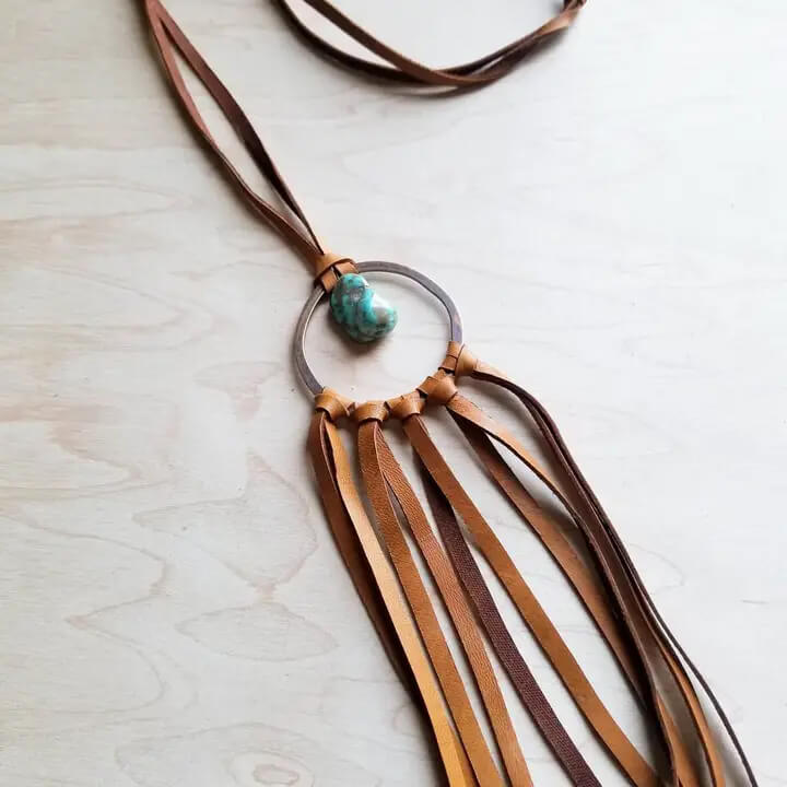 Genuine leather dream catcher necklace can be worn alone or layered. Approximately 38 inches in length. Can be adjusted with self-tie closure. Genuine leather tassel is approximately 8 inches.