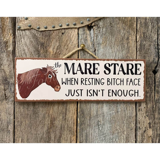 Wooden sign with a horse illustration and humorous text on a wooden background