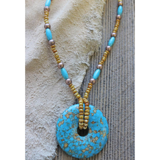 Treasures of the West necklace is handcrafted by artisans from the Black Hills of South Dakota. A magnesite turquoise semi-precious stone with copper and turquoise beads in this southwest design measuring 16-20."