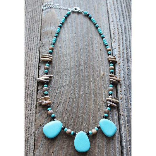 The semi-precious stone “magnesite” enhanced with turquoise, helps break the bonds of dependency and uncovers thoughts &amp; feelings that are no longer self serving. The necklace measures 16-20″ this striking piece is natural and unique. Matching earrings sold separately.