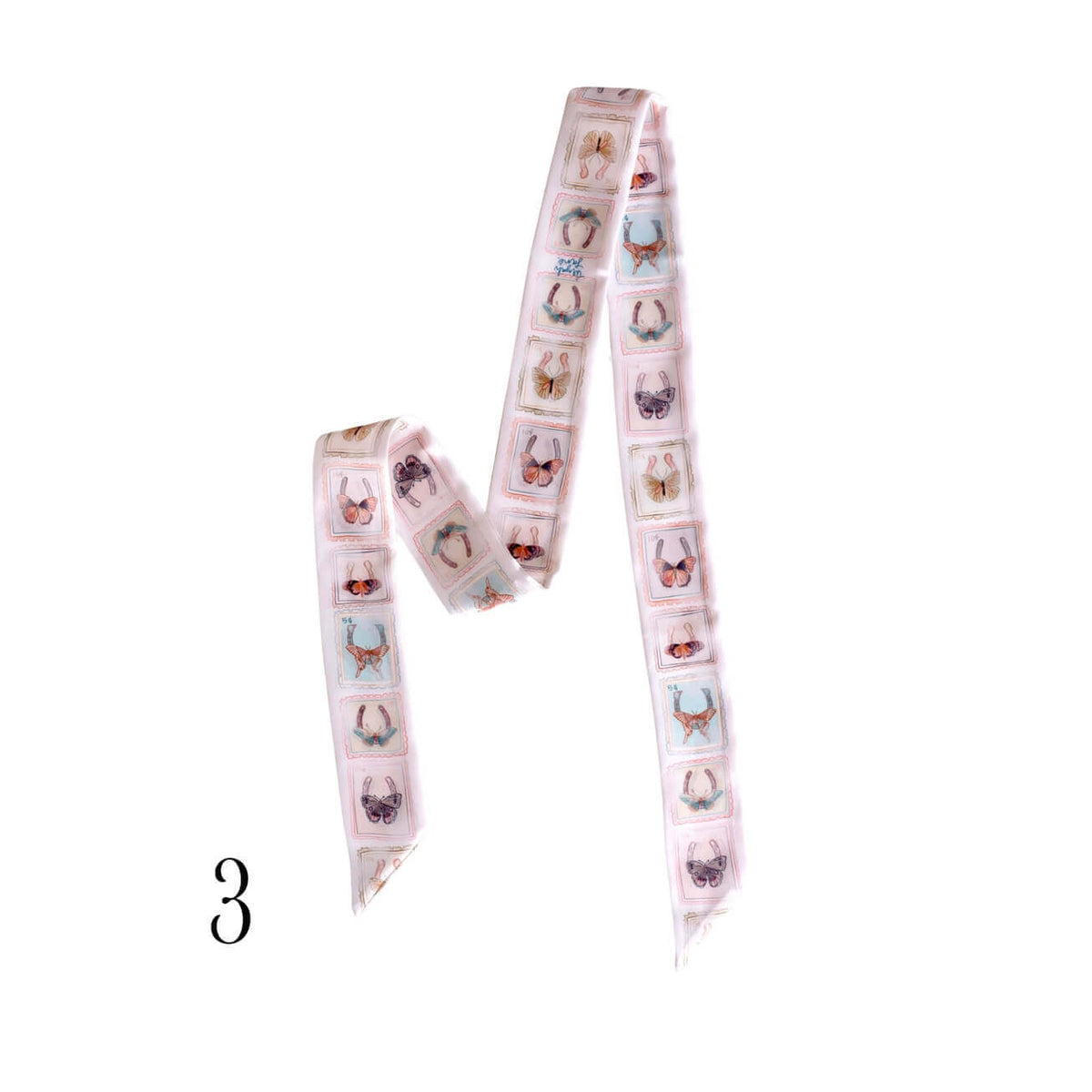A long, narrow decorative silk twilly with a repeating pattern of small illustrated animals in pastel colors on a pale pink base, shown on a plain white background. A black number '3' appears in the lower left corner.
