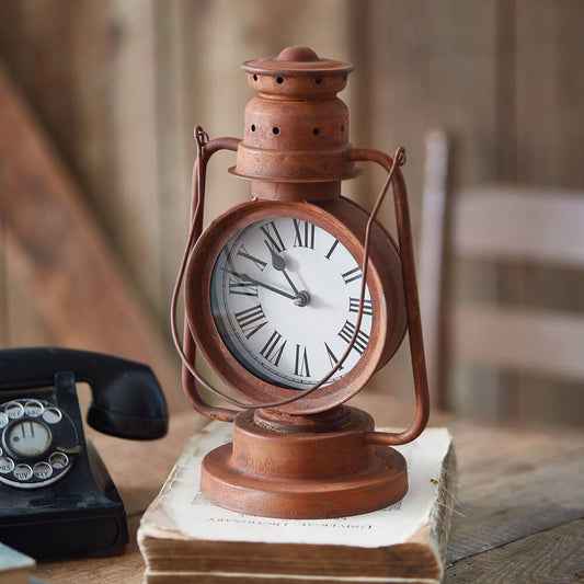 Fashioned as a repurposed kerosene lantern, this unique clock will bring a rustic touch to a home. This item can be hung with a hook by its metal loop. Item is 18''H with the handle extended. The clock requires 1 AA battery, not included. Measurement: 8''W x 6''D x 12¾''H