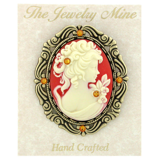 This vintage reproduction Victorian style cameo pin gives you a real heirloom look and feel at a great price! The large, 40x30mm carnelian color cameo is set in a lace edged bezel on a decorative antiqued natural brass frame. Pin measures 2.25 inches long by 1.75 inches wide...decorated with Swarovski Elements Topaz Austrian Crystal.