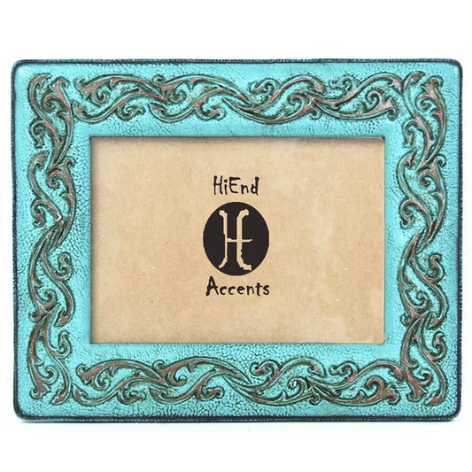 Designed to represent leather, this hand painted scrollwork on sturdy turquoise pained resin makes for an elegant touch. For photographs measuring 5" X 7". Can be utilized with either vertical or horizontal photographs. Back has swing tabs for easy installation, and a thick layer of glass protects your image. Imported