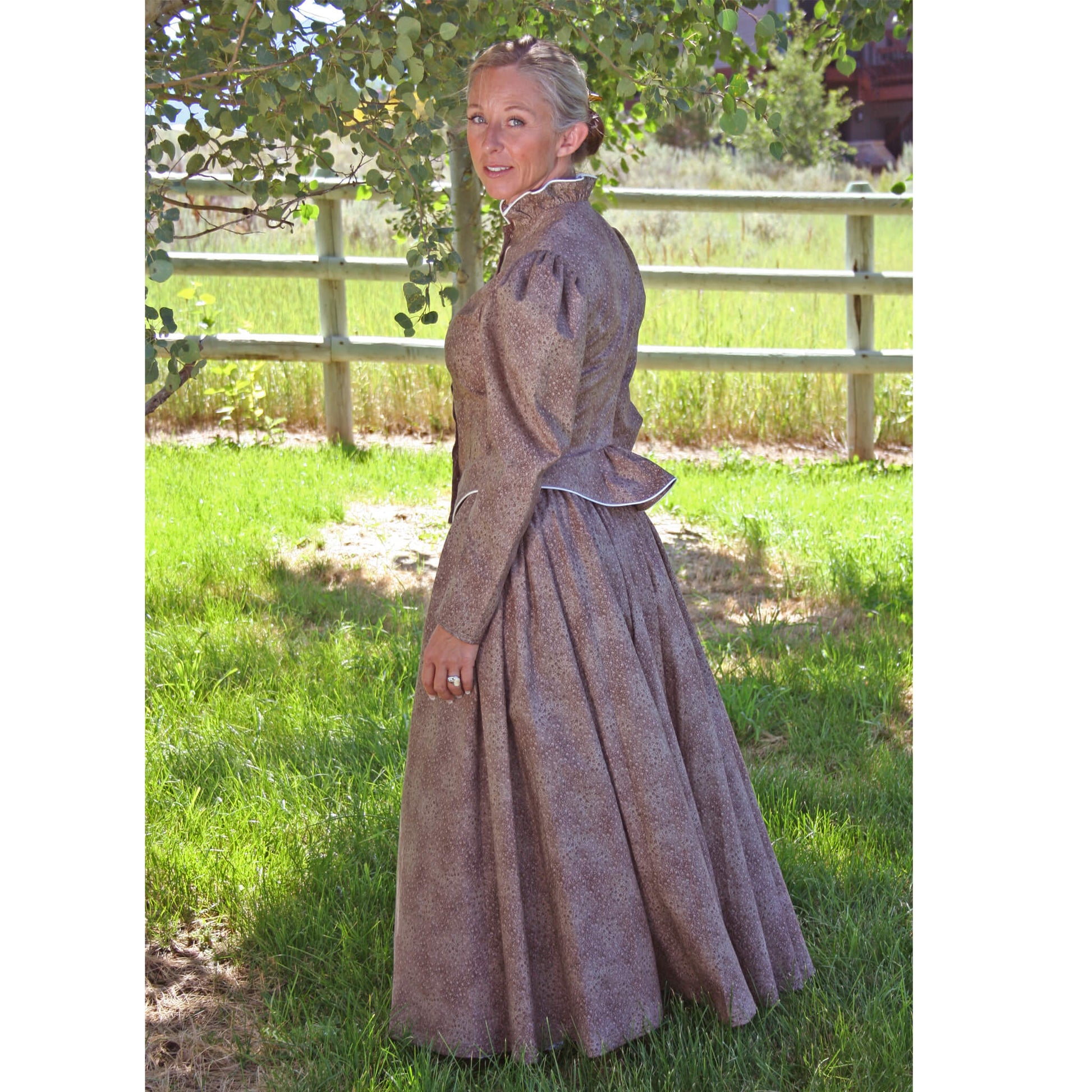 You can wear this finely made walking skirt and jacket almost anywhere. Skirt has two side pockets and is fully gathered in back for a bustle effect. The fitted jacket is detailed with cream piping. Skirt is frontier length, approximately 35" long. Wear it with our petticoat sold separately. Offered in navy, brown or moss. Made of 100% Cotton. Made in USA.