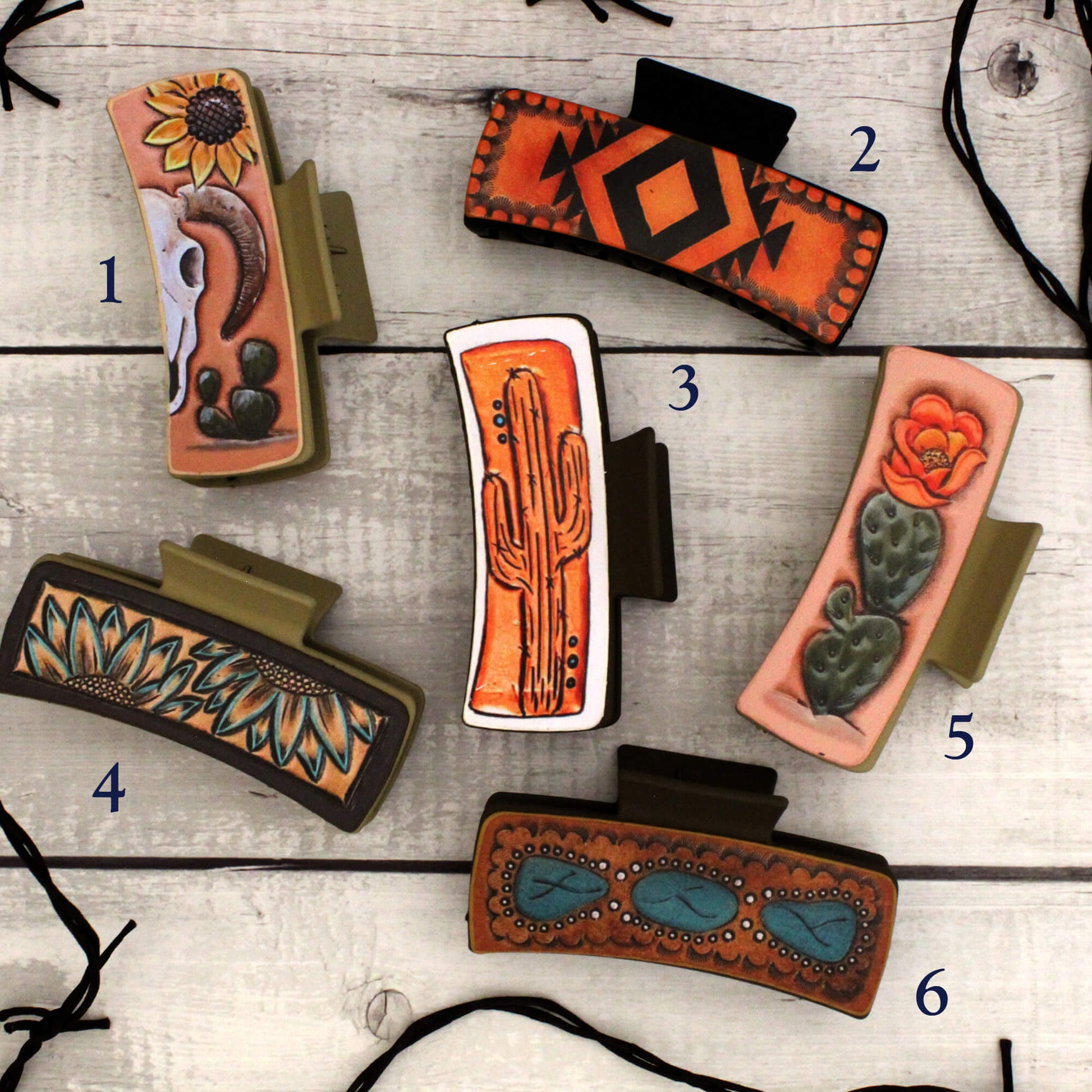 Collection of decorative hair clips with various patterns on a wooden surface