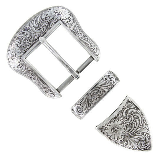 Silver belt buckle with intricate floral patterns on a white background