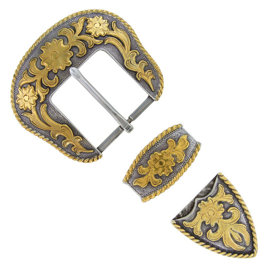 Decorative belt buckle with gold and silver design on a white background