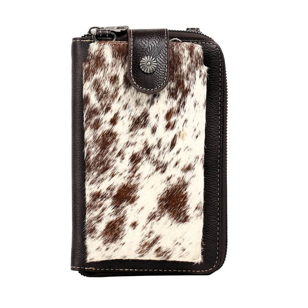 Saddle up with the Western Genuine Cowhide Phone Crossbody Wallet - the perfect accessory for the modern cowgirl. This floral tooled wallet features genuine hair-on cowhide with an antique silver concho button flap, bringing rustic western styling to your everyday carry.