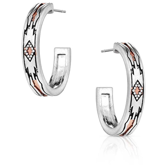 Silver hoop earrings with rose gold accents on a white background