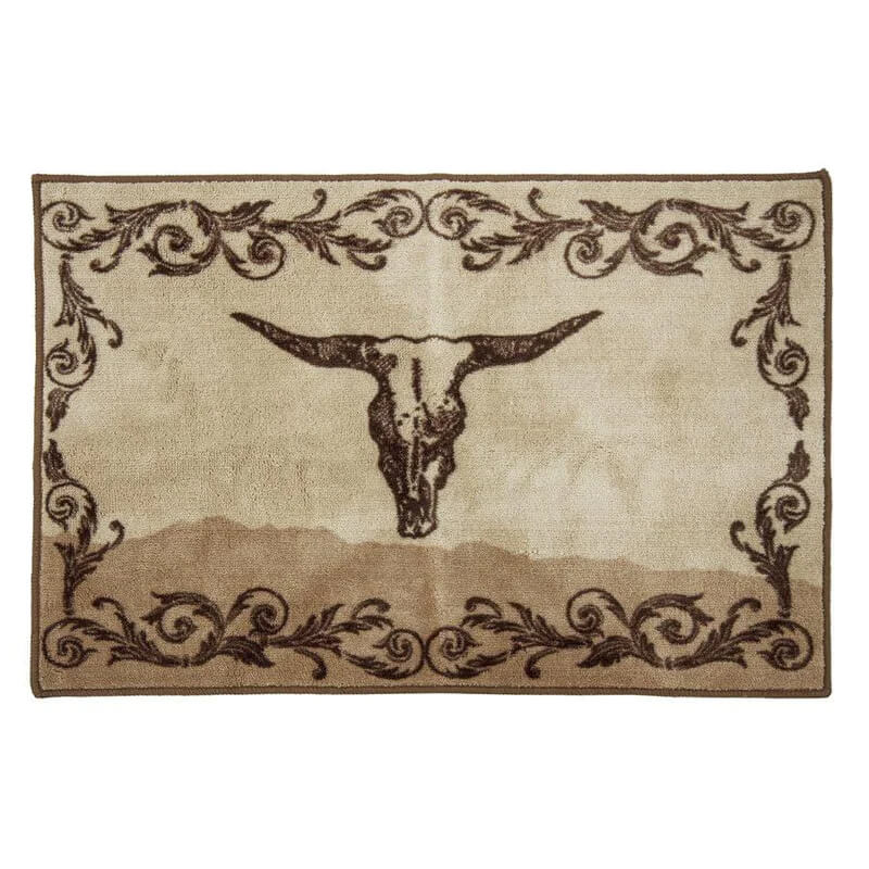 Designed for the Wyatt collection, this cream and tan rug features a printed longhorn skull surrounded in feathered scrollwork. It will complement a variety of western spaces.