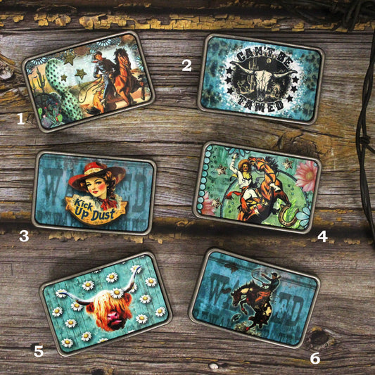 These western belt buckles have a flair for fun, whimsy &amp; a little snark, They are completely made of metal (image area too) and are made to be durable and lasting! Buckles are designed, crafted &amp; created right in the heart of the USA. Measures: -3x2" -Fits any interchangeable snap belt 1" to 1.5"