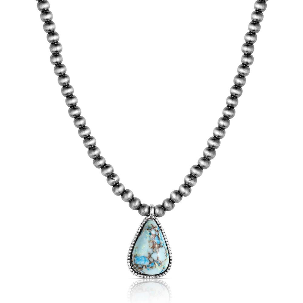 Necklace with a teardrop-shaped turquoise pendant on a white background