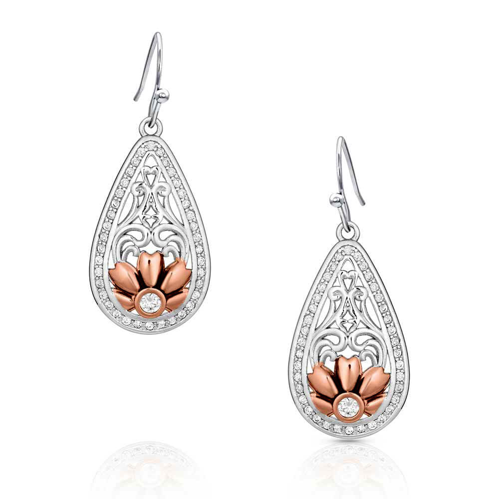 Accented with a beautiful rose gold finished flower these medium sized teardrop earrings begin with flowing open filigree going down to the rose gold pedaled flower with a large clear stone set in the center.&nbsp; The outside of the earring is lined with small clear stones accepting the inner design. Earrings sway from hypoallergenic French hooks.