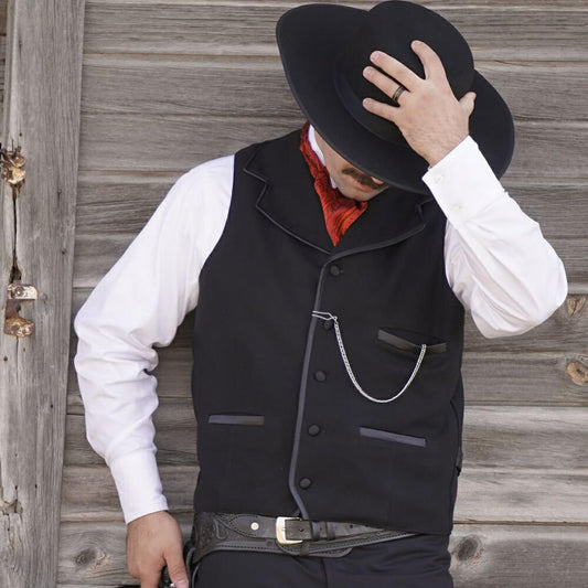 Similar to the vest worn by Kurt Russell as Wyatt Earp in “Tombstone”, this iconic style vest will help you walk the street in confidence. Notched lapels are sewn into the shoulder seam and trimmed in satin bias with three matching satin welt pockets and back belt. Made of 100% wool and lined in polyester. Dry Clean. Made in USA. 