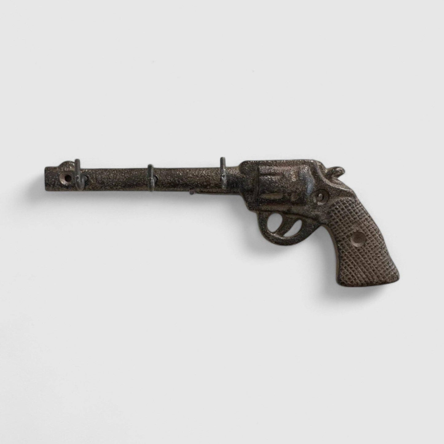 Western Cast Iron Vintage Revolver Gun Wall Hook designed for hanging coats and keys.
