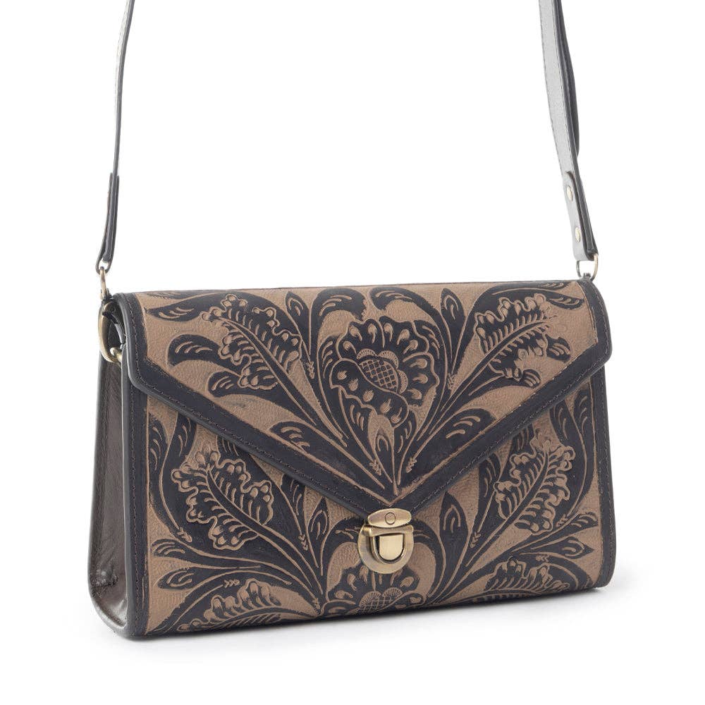 Floral patterned handbag with a gold clasp on a white background