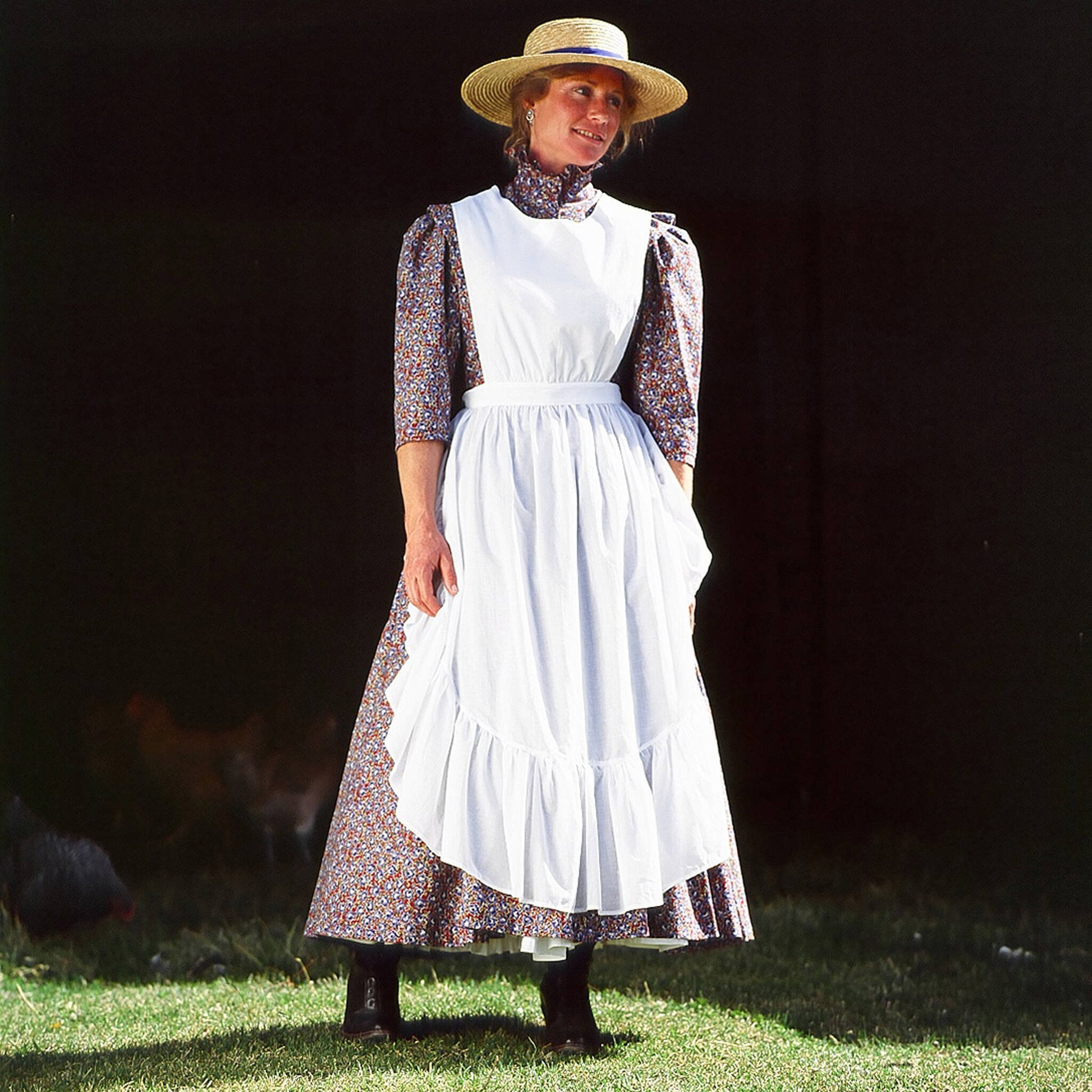 From the classroom to the barnyard, all you need is this chicken feeding apron to finish the day's chores. Big enough to cover a full skirt or to hold an apron full of chicken feed. Made of 100% fine cotton batiste. Adjustable back tie. One Size fits most. Made in USA