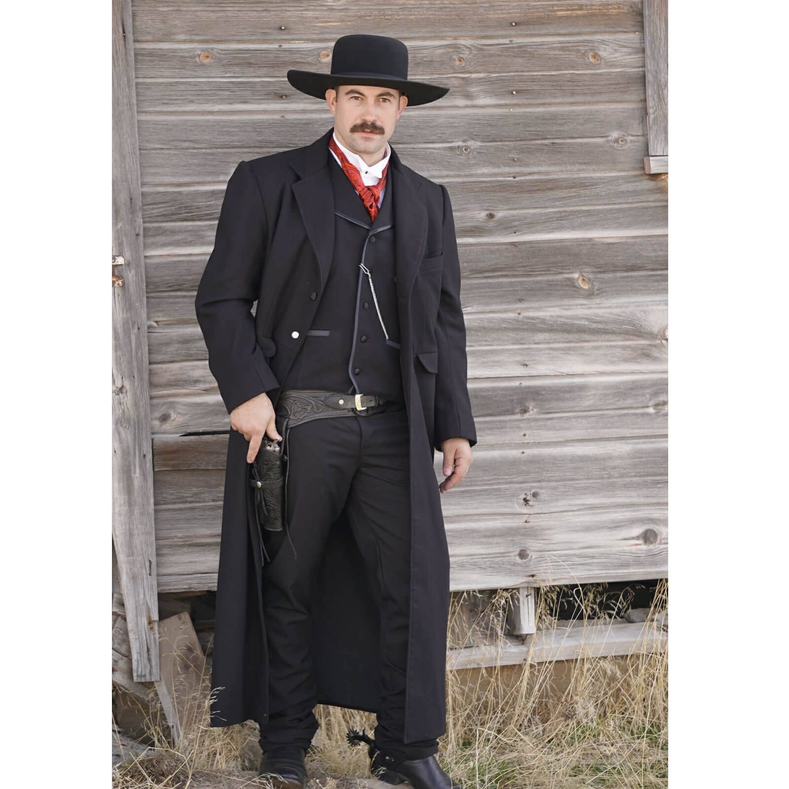 This is a long version of our Frock Coat reminiscent of the coat worn by Kurt Russell at the end of the film “Tombstone”. Cut long to ankle-length, features two front flap pockets, a chest welt pocket and an inside pocket. Made of a medium weight 100% Wool Flannel and lined in polyester. Made in the USA. Dry Clean. Made in USA.