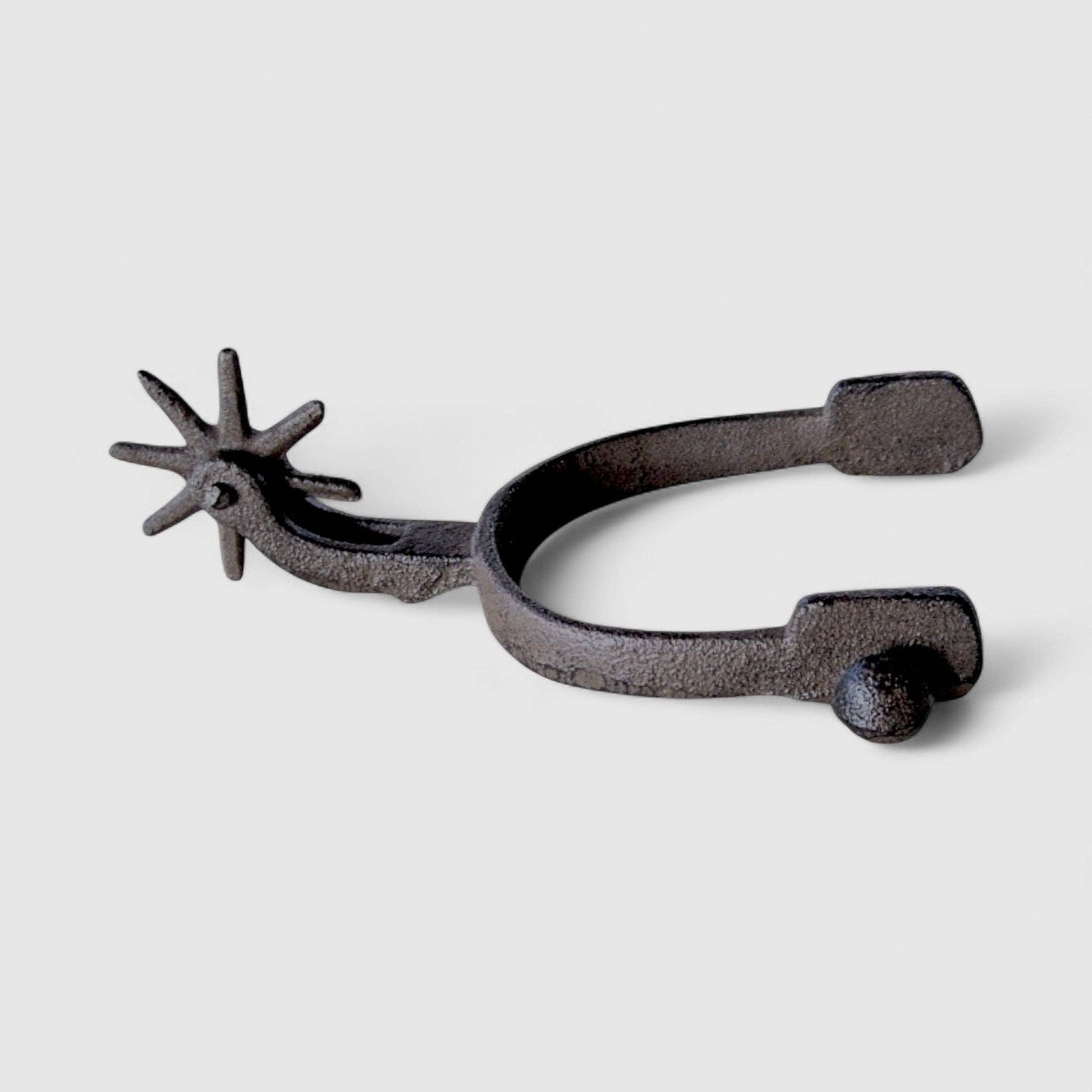 Old West Cast Iron Spur - Frontier Decor Accent showcasing detailed rowel and sturdy design.