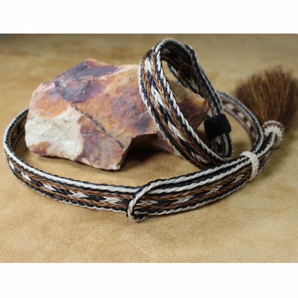 This horsehair hatband and bracelet set paired together make great coordinating accessories. The horsehair hatband is 5/8" wide and is adjustable with a side horsehair tassel. The matching bracelet adjusts to any size wrist and is also 5/8" wide. Choose from brown or black set or get both!