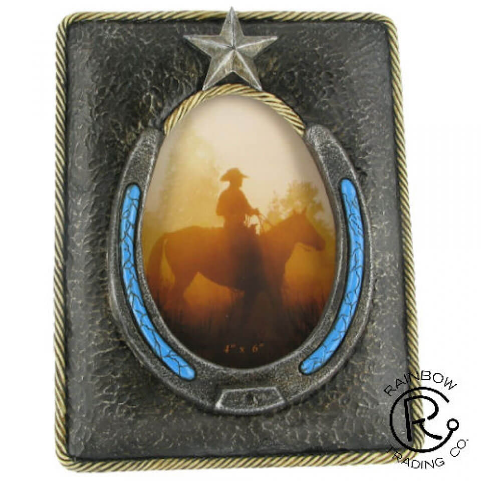 Western Picture Frame with horseshoe around picture that has turquoise accents. Frame dimensions are 9in x 7in and holds a 4x6 oval shaped picture. Imported.