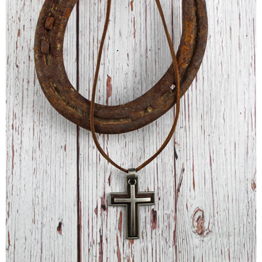 This cross necklace is sure to draw compliments. It has a double cross with a leather inset. It sits on a leather cord that is adjustable between 22” and 34” for that perfect fit. Imported.